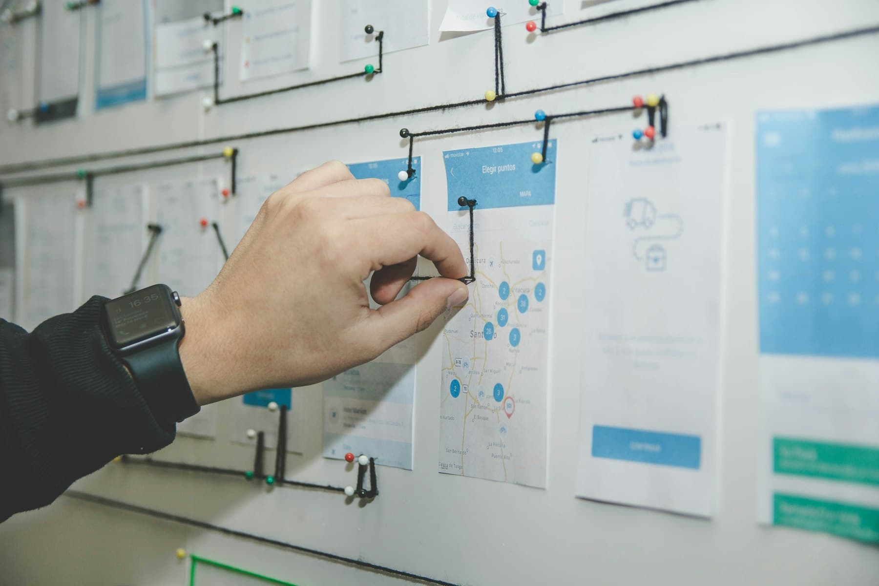 Engineer mapping a business workflow on a whiteboard